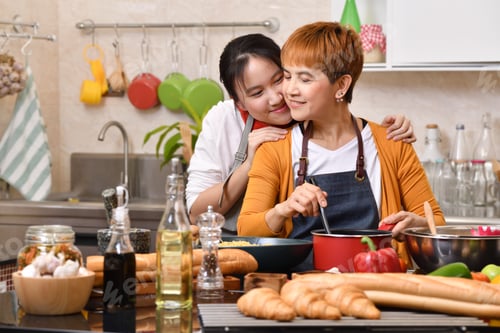 Preview: Mother and daughter cooking in the kitchen