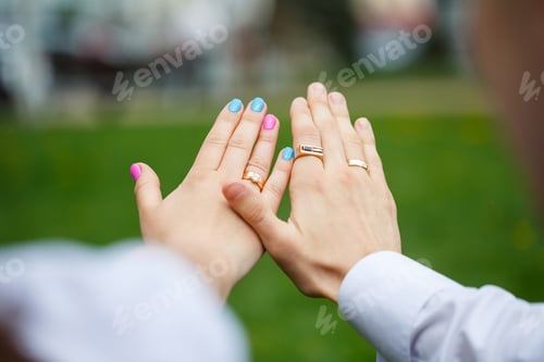 Preview: Golden wedding rings for newlyweds on their wedding day