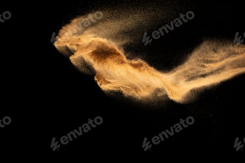 Preview: Sand explosion isolated on black background. Freeze motion of sandy dust splash
