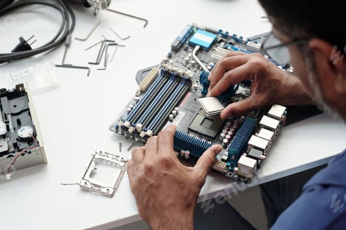 Preview: Assembling Computer Parts on White Table