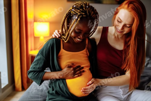 Preview: mixed race couple awaiting a baby in room