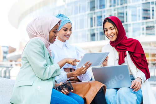 Preview: Beautiful muslim girl wearing hijab bonding outdoors