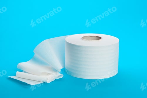 Preview: Roll of toilet paper on a blue background ready for use in a restroom setting