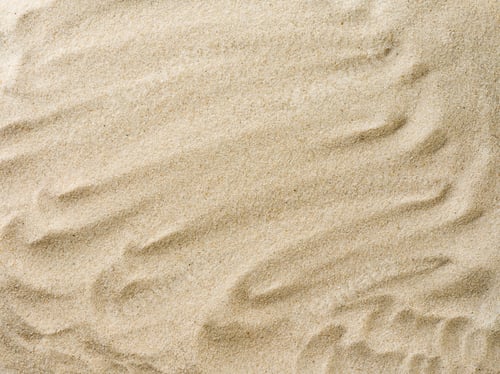 Preview: Beach sand background with natural wave pattern. Summer background of beach sand with small
