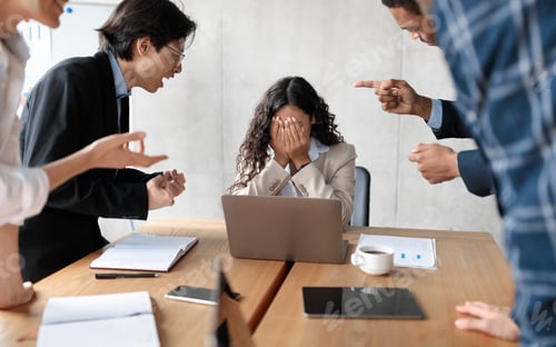 Preview: Aggressive Coworkers Yelling At Victimized Businesswoman Sitting In Modern Office