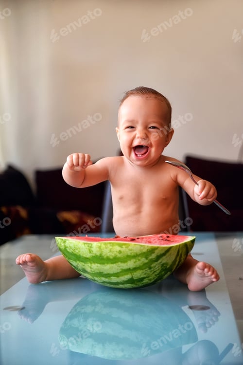 Preview: Happy Baby Eating Watermelon with a Fork