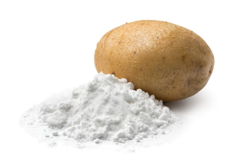 Preview: Heap of potato starch and a fresh potato