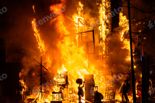 Preview: Fire of a fallero monument, burning with high flames during the night.
