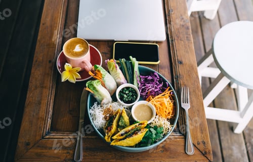 Preview: meal for losing weight smartphone and closed laptop technology on table in cafe
