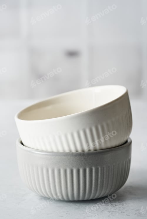 Preview: Two Rustic Ceramic Bowls white, gray Color Monochrome Baking background.
