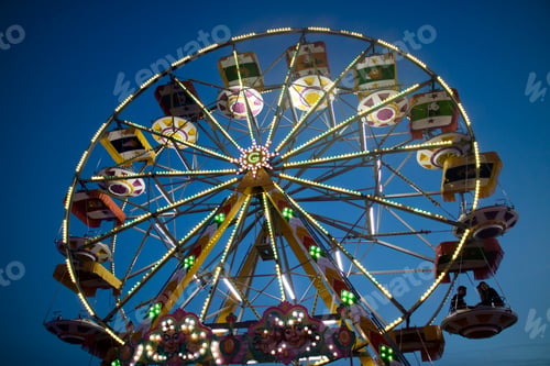 Preview: Inside an amusement park the colors of the Ferris wheel