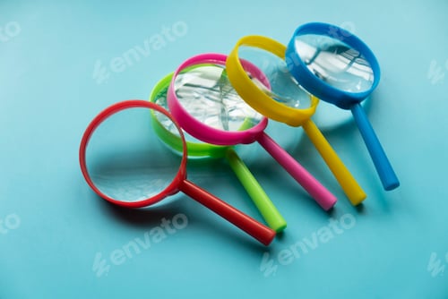 Preview: Colorful magnifying glass over a blue background.
