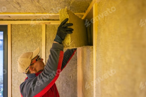 Preview: Contractor Installing Mineral Wool Inside Garden Shed Walls.