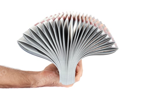 Preview: Pile of magazines in hand