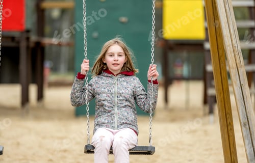 Preview: Cute little girl riding a swing