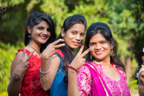 Preview: Happy Indian young girls smiling and having fun at outdoor.