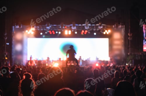 Preview: Silhouette youth audience are watching the night concert