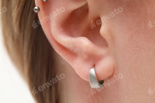 Preview: Woman with dry skin on white background, closeup of ear