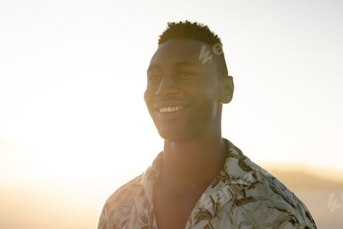 Preview: An African American man enjoying free time on beach on a sunny day