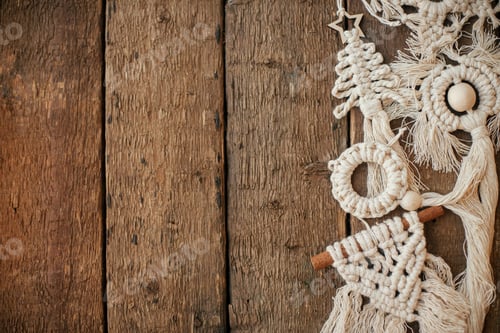 Preview: Stylish christmas macrame ornaments border on rustic wood flat lay. Handmade boho tree ornaments