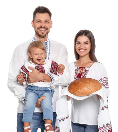 Preview: Happy Ukrainian family in embroidered shirts with korovai bread on white background