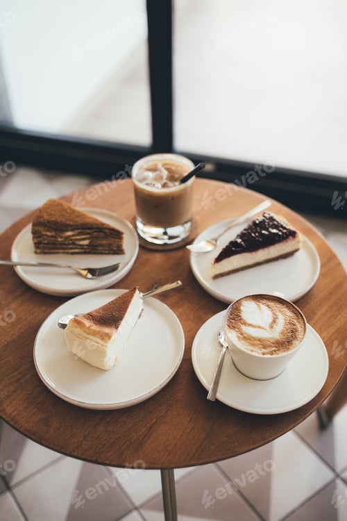 Preview: Desserts and coffee on wooden table.