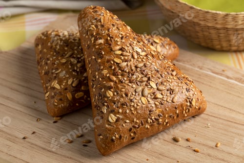 Preview: Pair of fresh multi grain buns on a cutting board close up