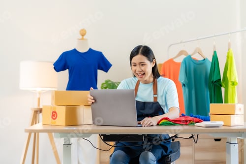 Preview: Small business owner Asian woman who are delighted with successful at home.