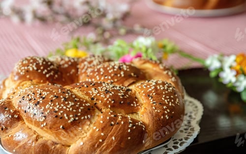 Preview: Easter sweet bread, greek tsoureki, brioche braid on table, close up view