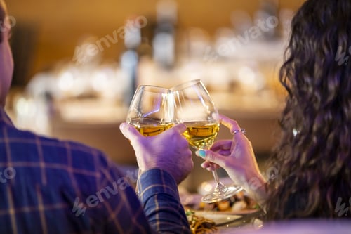 Preview: Selective focus shot of a couple drinking champagne together