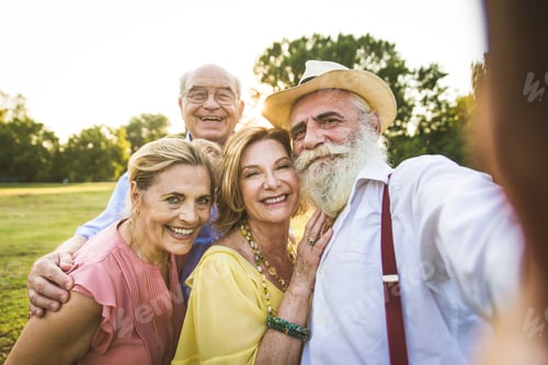 Preview: Group of senior people bonding outdoors