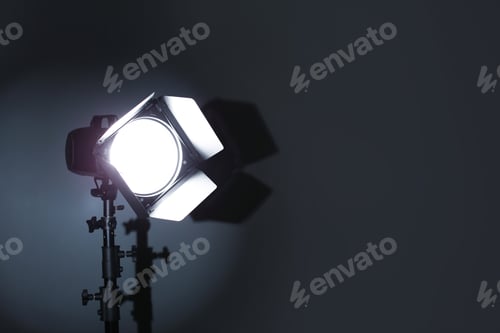 Preview: Professional photo studio lighting equipment on dark background. Space for text