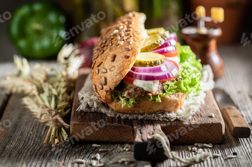 Preview: Homemade sandwich with roasted pork neck, gherkins and onion