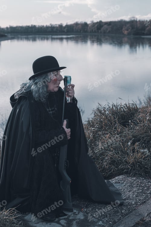 Preview: dark evil character holding euro cash outdoors a cloudy dark day - evil war grief concept