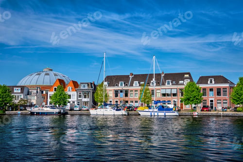Preview: Boats and houses on Spaarne river. Haarlem, Netherlands