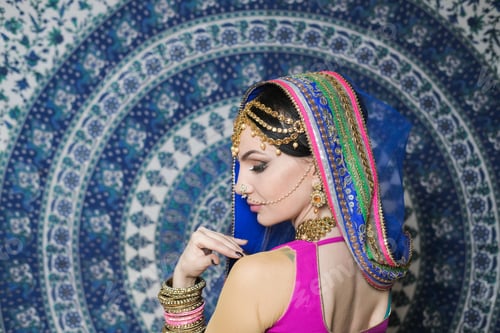 Preview: Portrait Of A Female Model In Ethnic Indian Costume With Jewellery And Traditional Makeup.