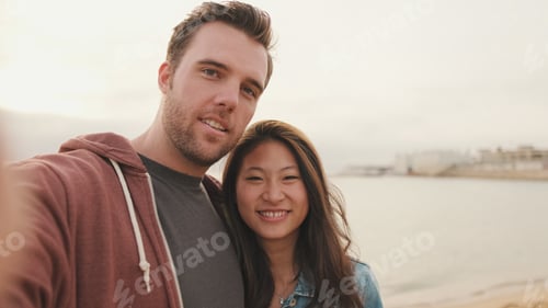 Preview: Laughing couple talking on video call