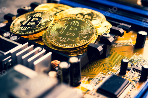 Preview: Golden coins with bitcoin symbol on a mainboard.