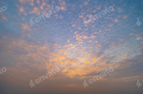 Preview: Sunset sky. Abstract nature background. Dramatic blue and orange, colorful clouds at twilight time.