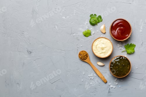 Preview: Many different sauces and herbs on table, flat lay top view. sauces with spices healthy concept