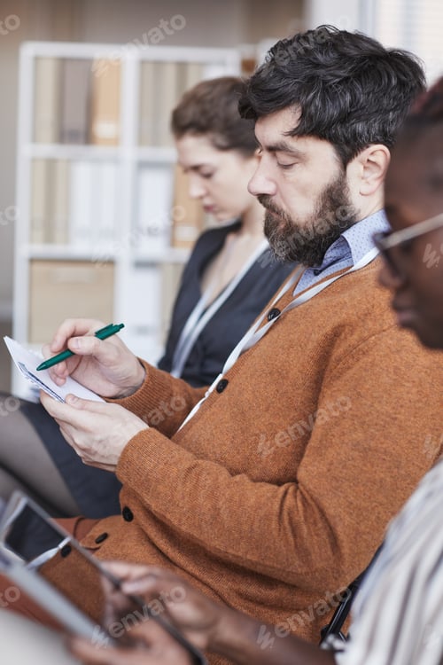 Preview: People Taking Notes at Conference