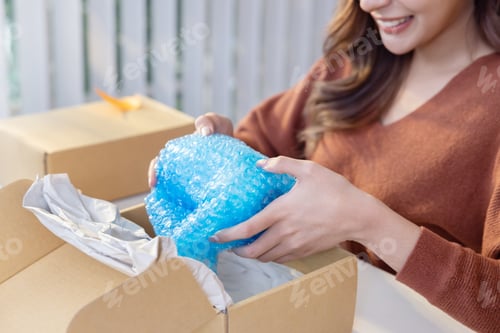 Preview: Female Online Sellers Packing a Fragile Vase