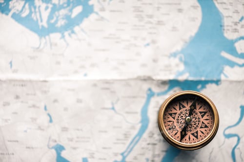 Preview: top view of vintage compass on map