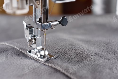 Preview: Modern Sewing Machine With Gray Velours Fabric Close Up