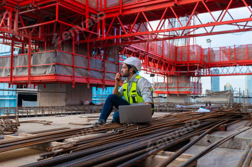 Preview: Portrait of an engineer designing a concrete floor and column structure for a shopping center.