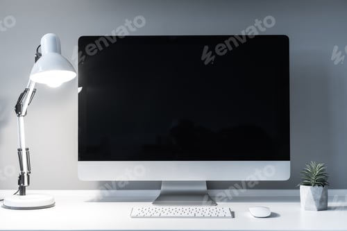Preview: working place with computer and switched on table lamp