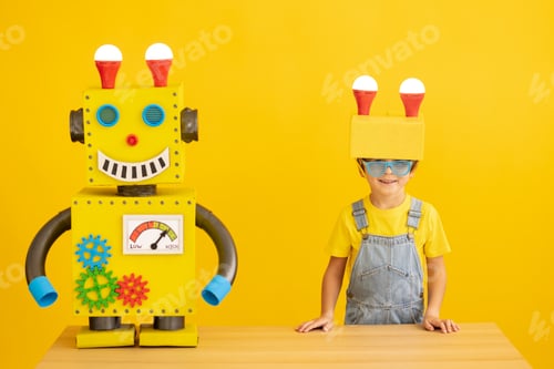 Preview: Happy child playing with robot