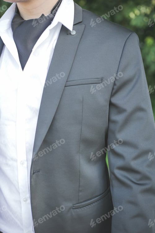 Preview: Vertical shot of a businessman with an elegant suit