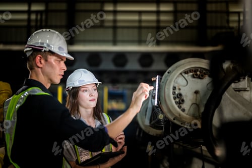 Preview: Factory engineers inspect on robot machine.