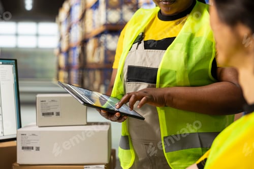 Preview: Staff members overseeing shipment numbers on packages in the warehouse